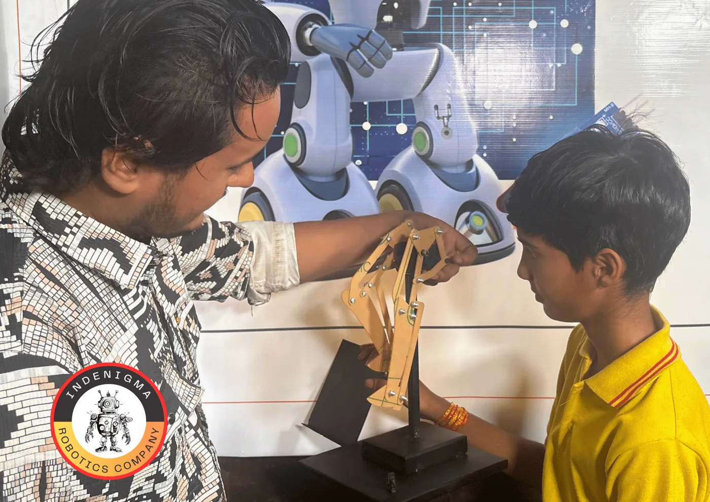 Learner and mentor exploring a Synergy Strider mechanism